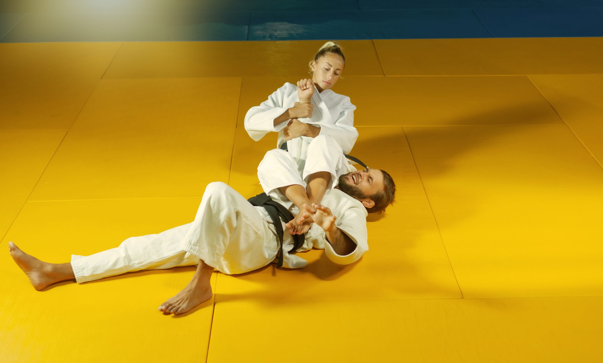 Martial arts. Sparing Portners. Sport man and woman in white kimono ...